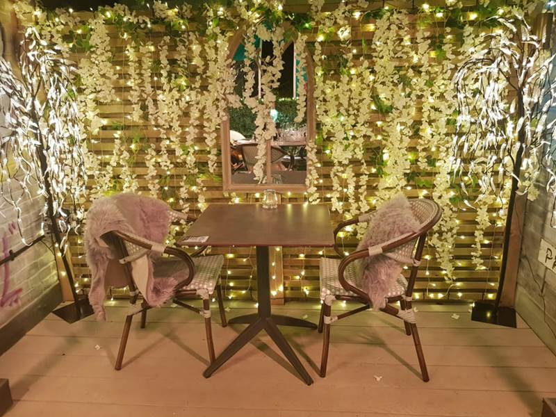 The Garden Terrace Seating Area at Hotel Indigo